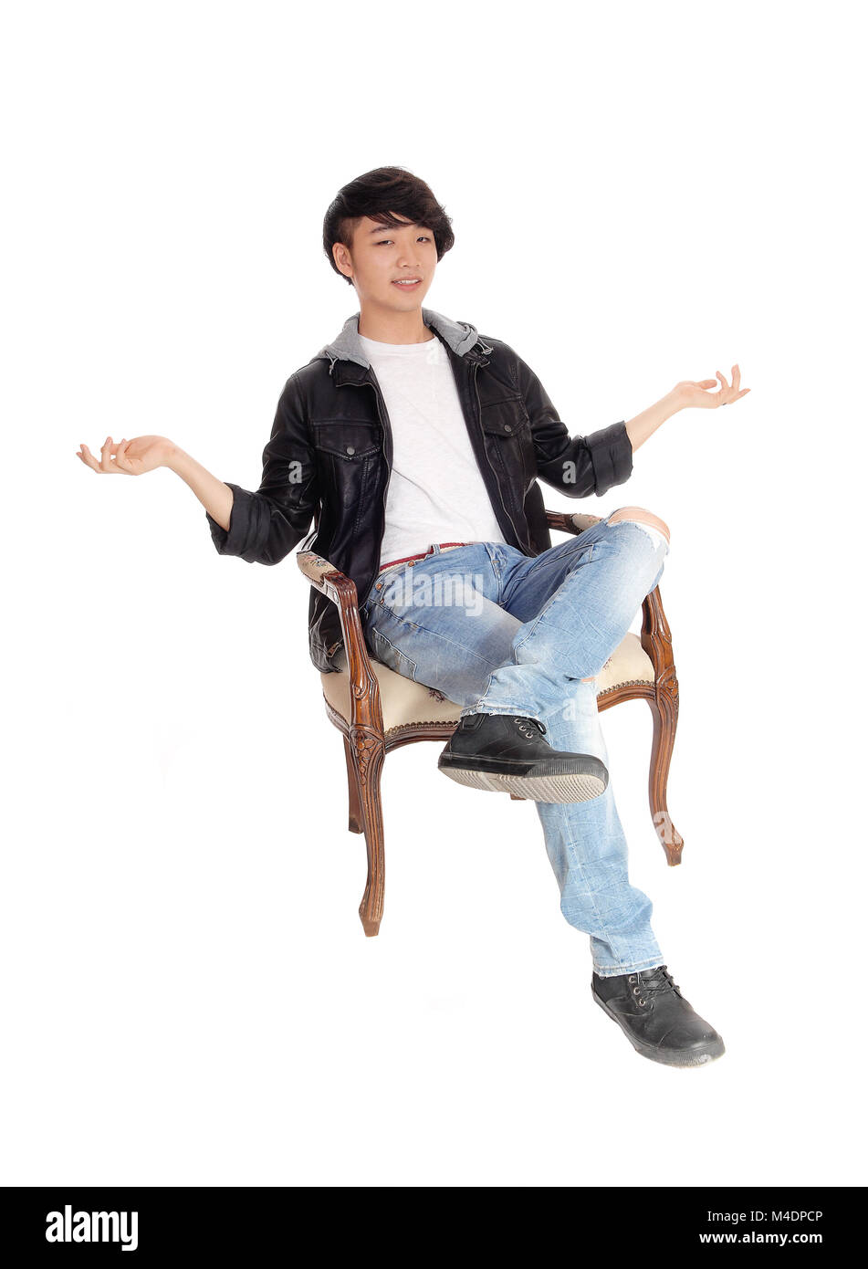 Adolescent asiatique assis et ne sais pas. Banque D'Images