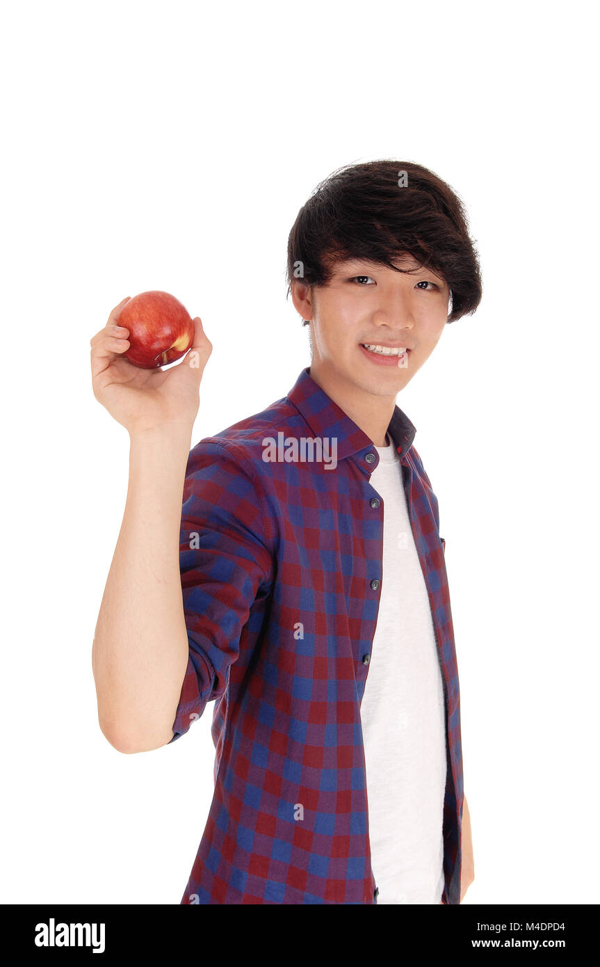 Happy teenager holding Red Apple. Banque D'Images