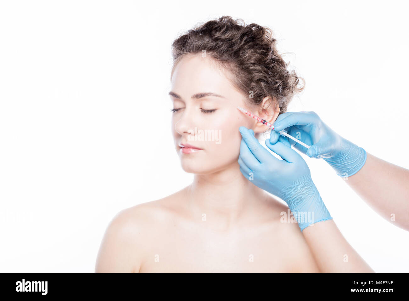 Young woman having botox injections visage. Banque D'Images