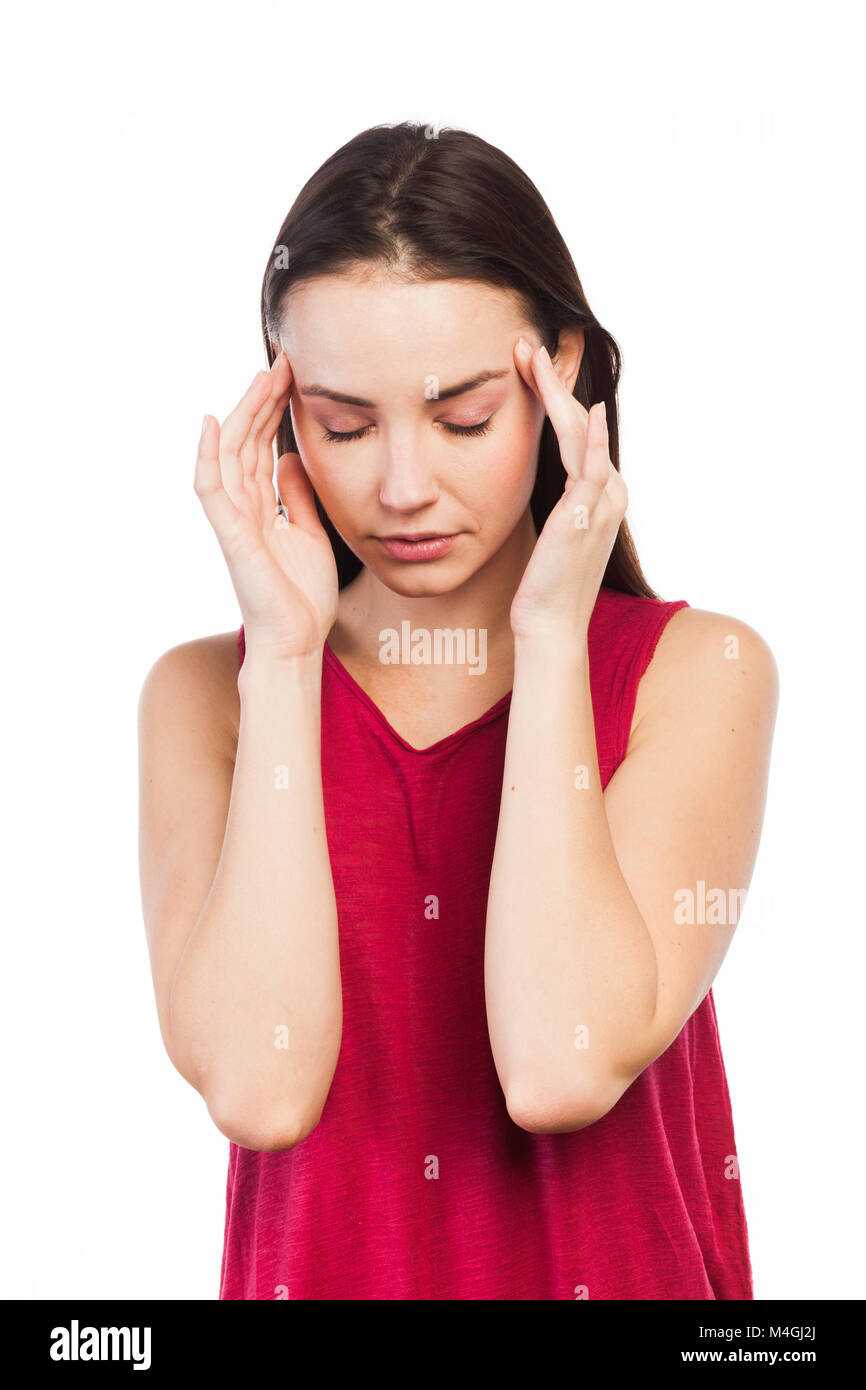 Portrait of a young woman having a headache, isolated on white Banque D'Images