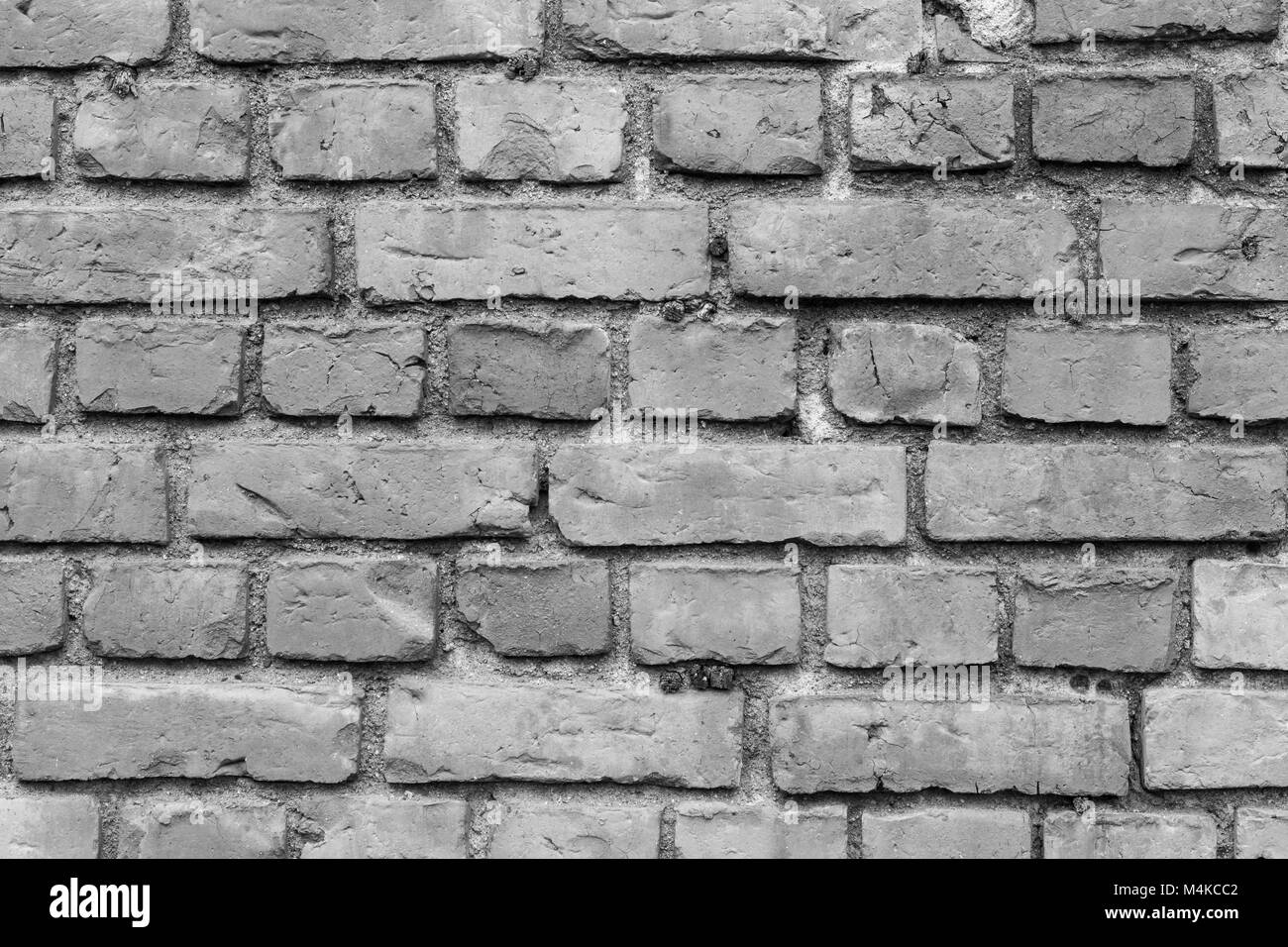 Vieux mur de briques détériorées texture background en noir et blanc. Banque D'Images