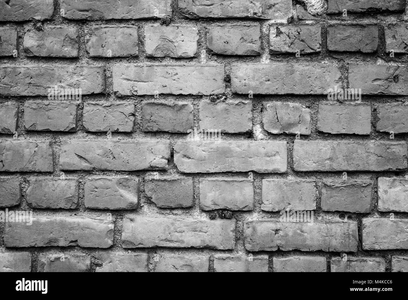 Vieux mur de briques détériorées texture background en noir et blanc avec le vignetage. Banque D'Images