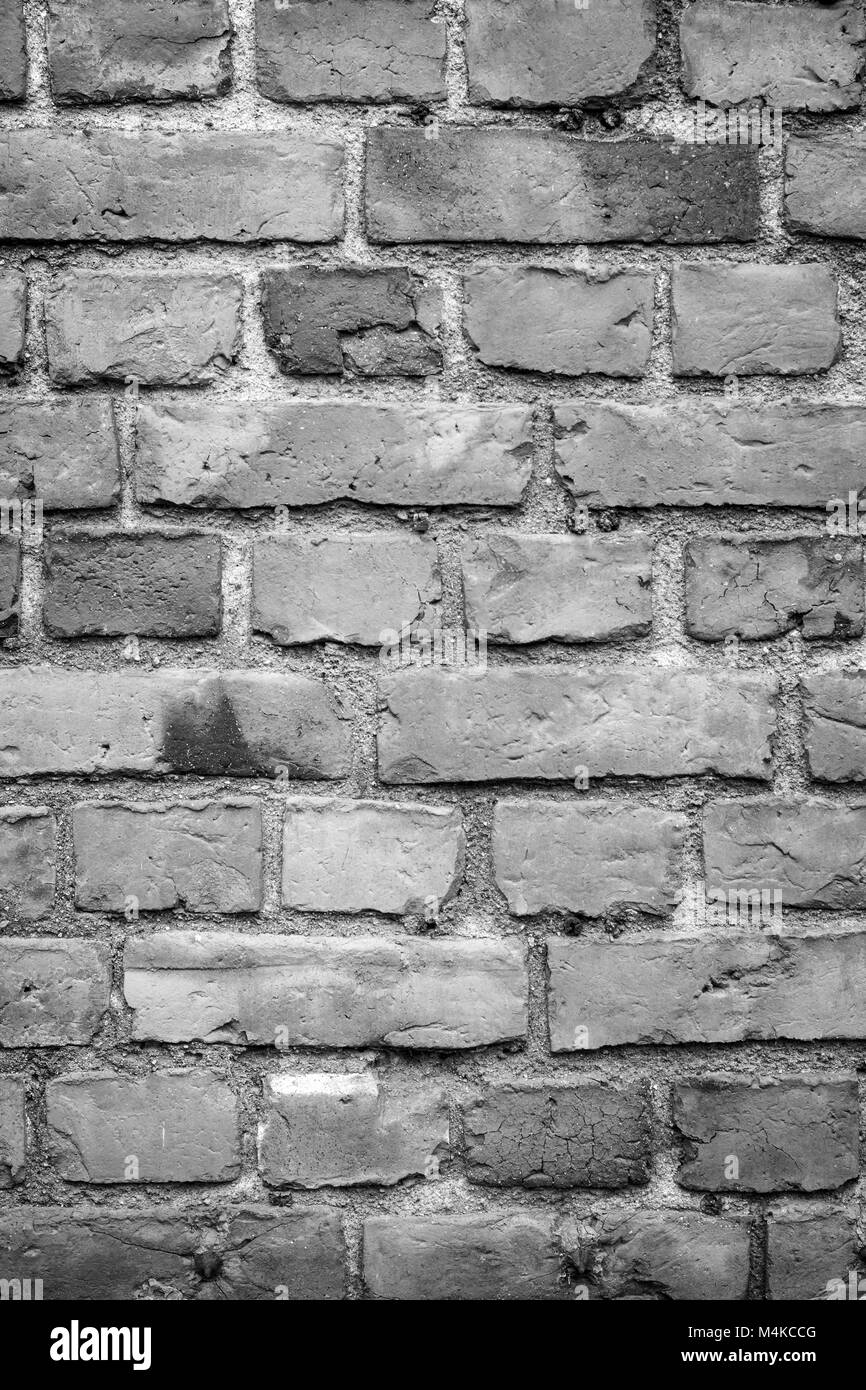 Vieux mur de briques détériorées texture background en noir et blanc avec le vignetage. Banque D'Images