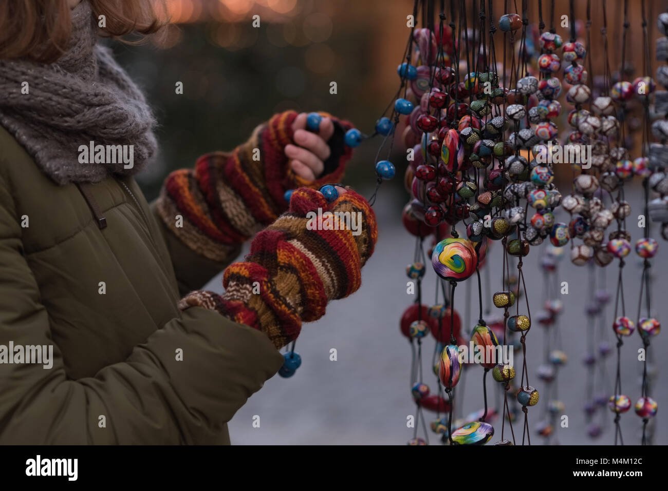 Woman in winter clothing holding christmas decoration Banque D'Images