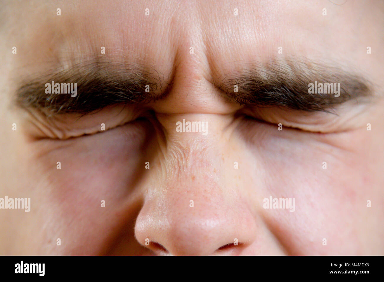 Close up of a Teenage boy's eyes bousillé Banque D'Images