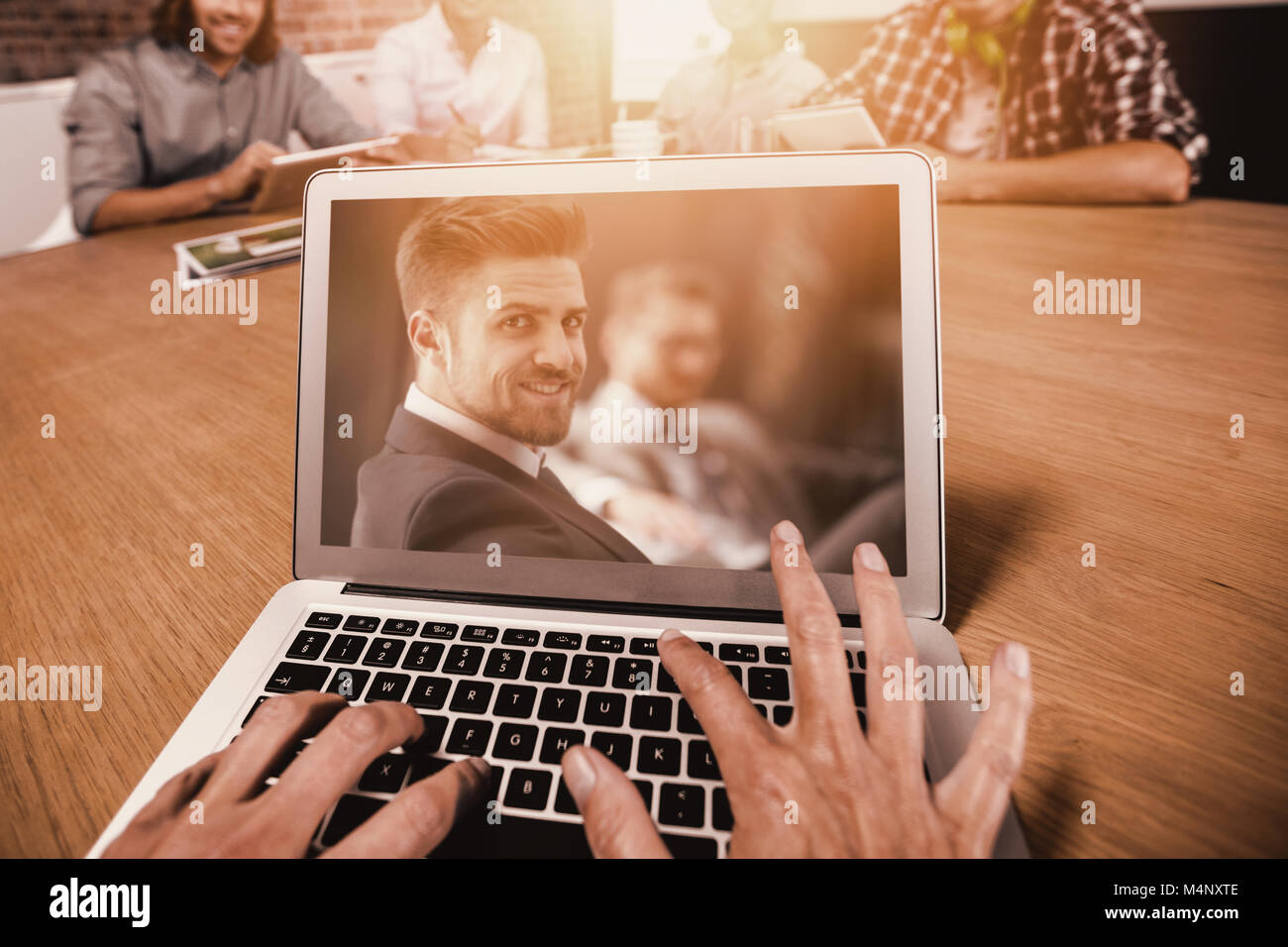 Image composite de l'image recadrée de woman typing on laptop Banque D'Images