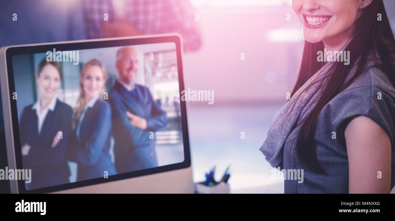 Composite image of cheerful businesswoman Banque D'Images