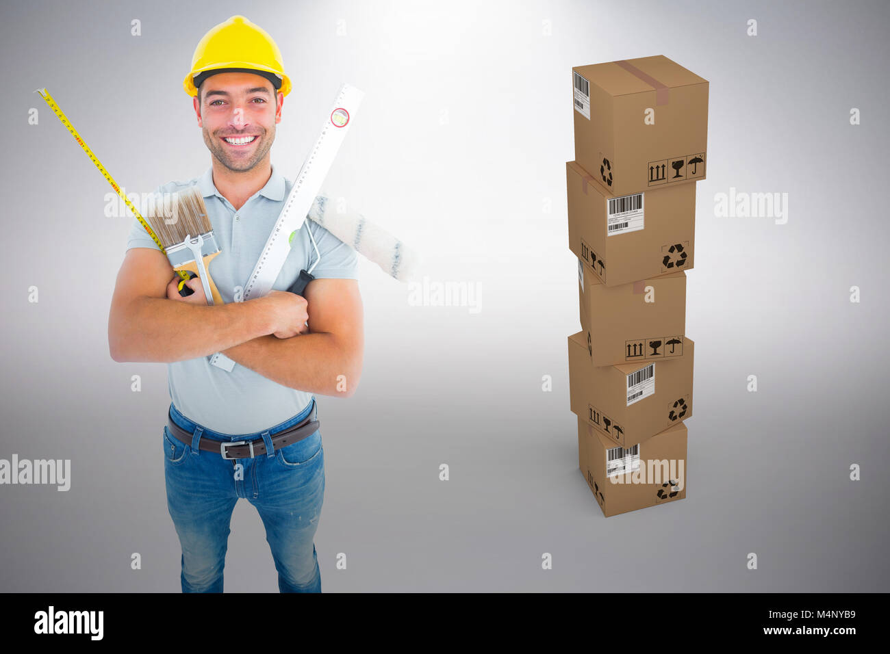 Image composite de portrait of happy worker holding divers outils manuels Banque D'Images