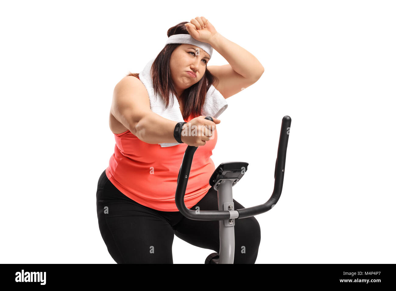 L'excès de fatigue femme exerçant sur une machine de cross-trainer isolé sur fond blanc Banque D'Images