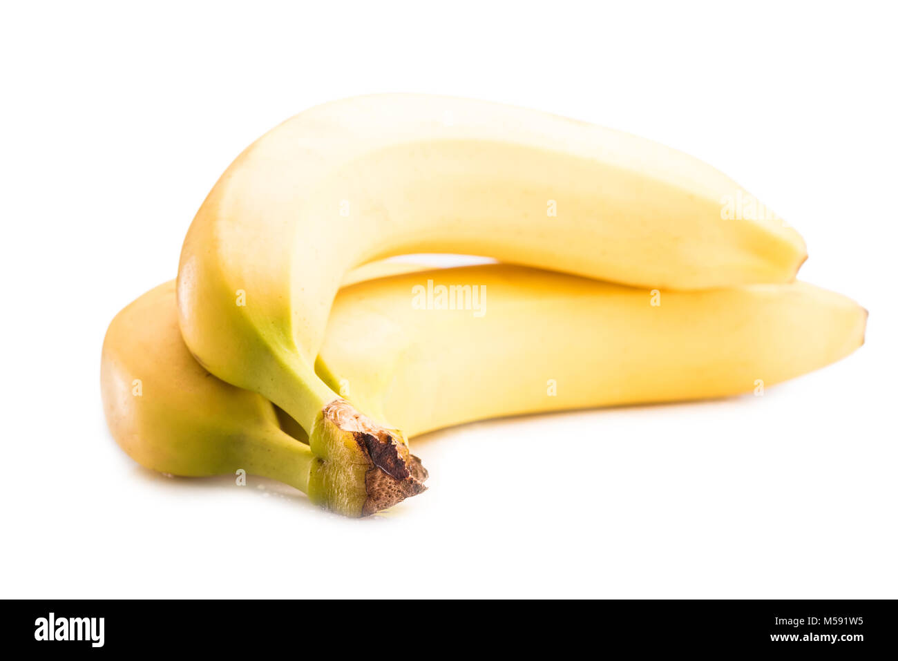 Vue en gros de produits frais et mûrs bananes jaunes isolated on white Banque D'Images