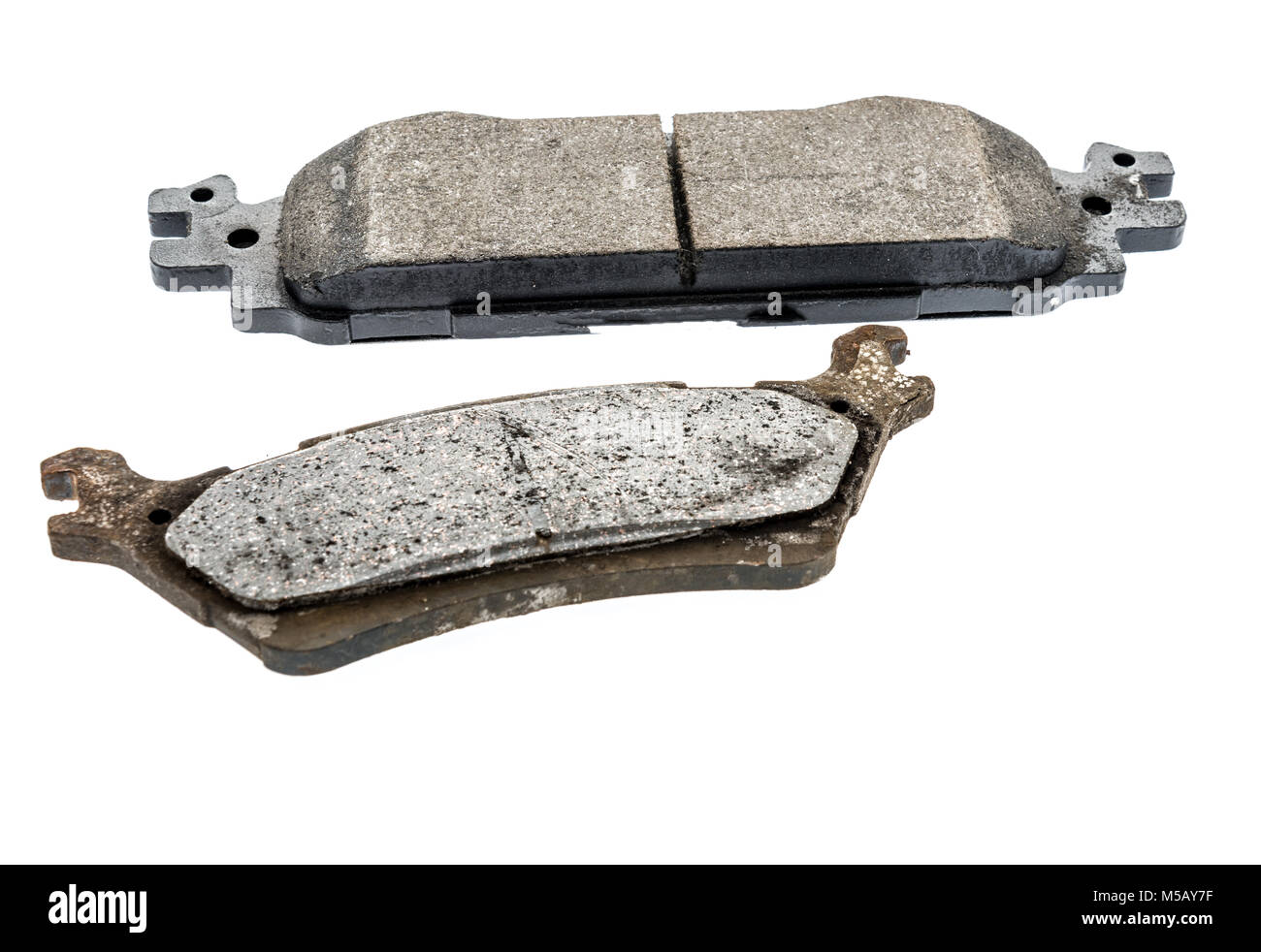 Une vieille et nouvelle plaquette de frein isolé d'un contexte Banque D'Images