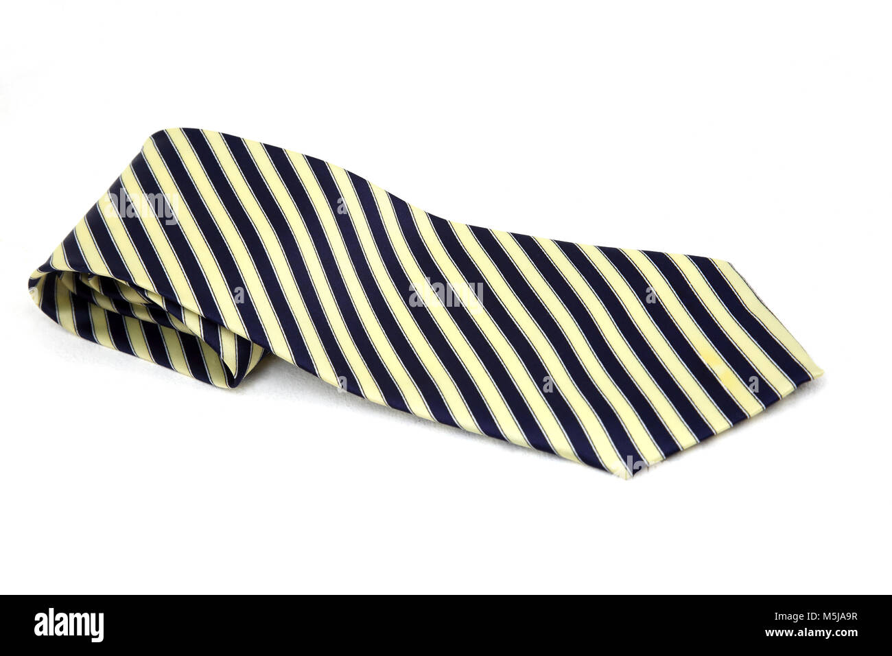 Le bleu et cravate rayée en soie ivoire Banque D'Images