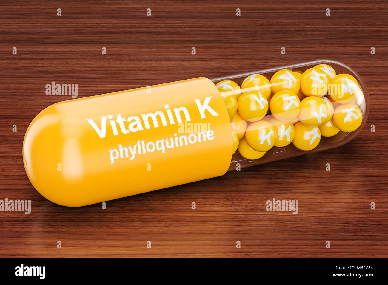 Capsule de vitamine K sur la table en bois. Le rendu 3D Banque D'Images