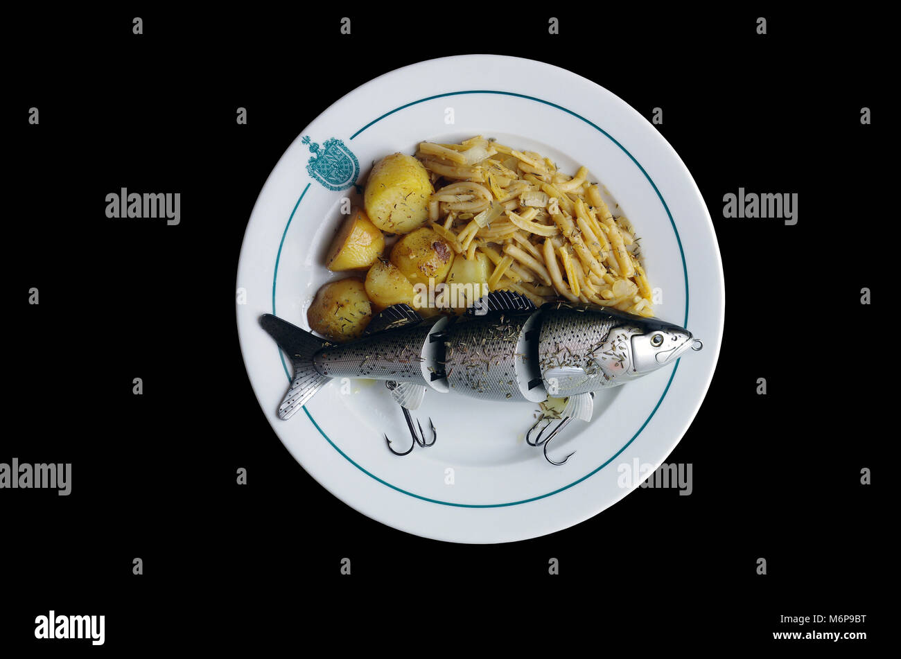 Leurre de pêche géant accompagné de légumes Banque D'Images