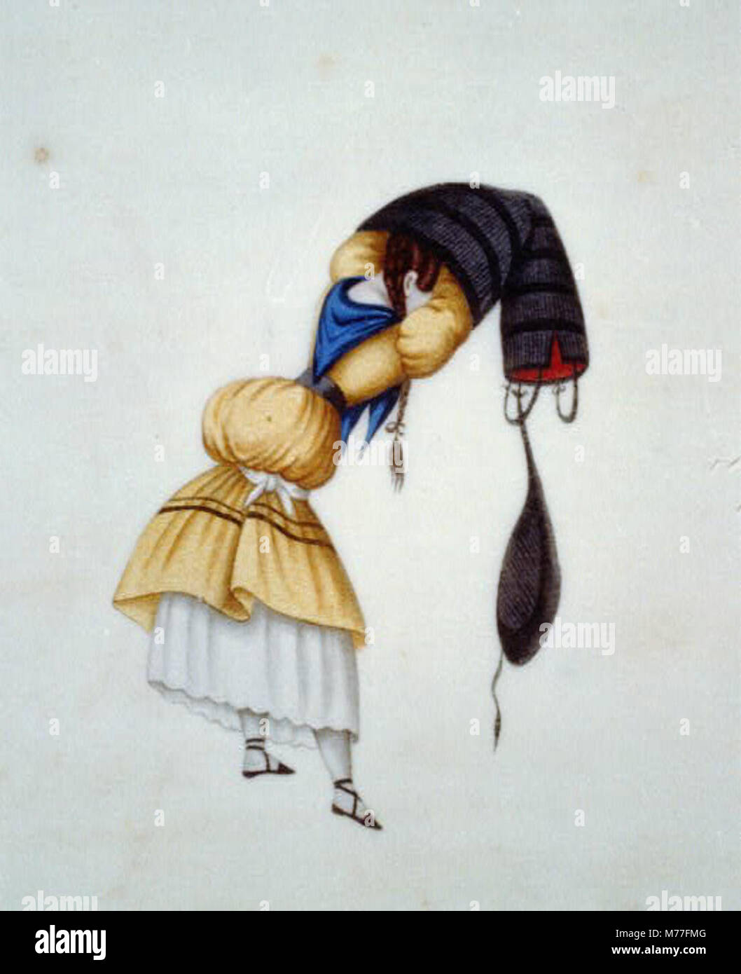 Une femme au Pérou est vue portant une jupe plissée traditionnelle, reflétant la tenue culturelle et la mode régionale du pays. Banque D'Images