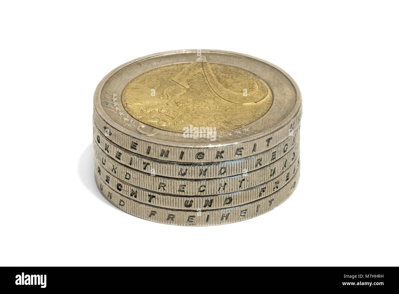 Les pièces en euros empilés avec les mots allemands - unité et droit et liberté Banque D'Images