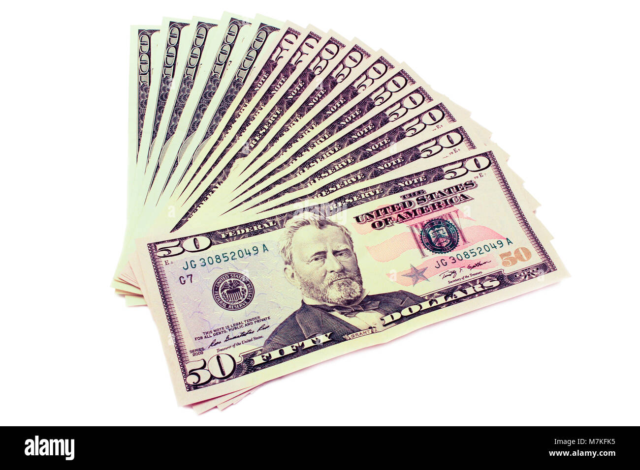 Dollars déployer comme un ventilateur isolé sur fond blanc. Banque D'Images Dollars déployer comme un ventilateur isolé sur fond blanc. Banque D'Images