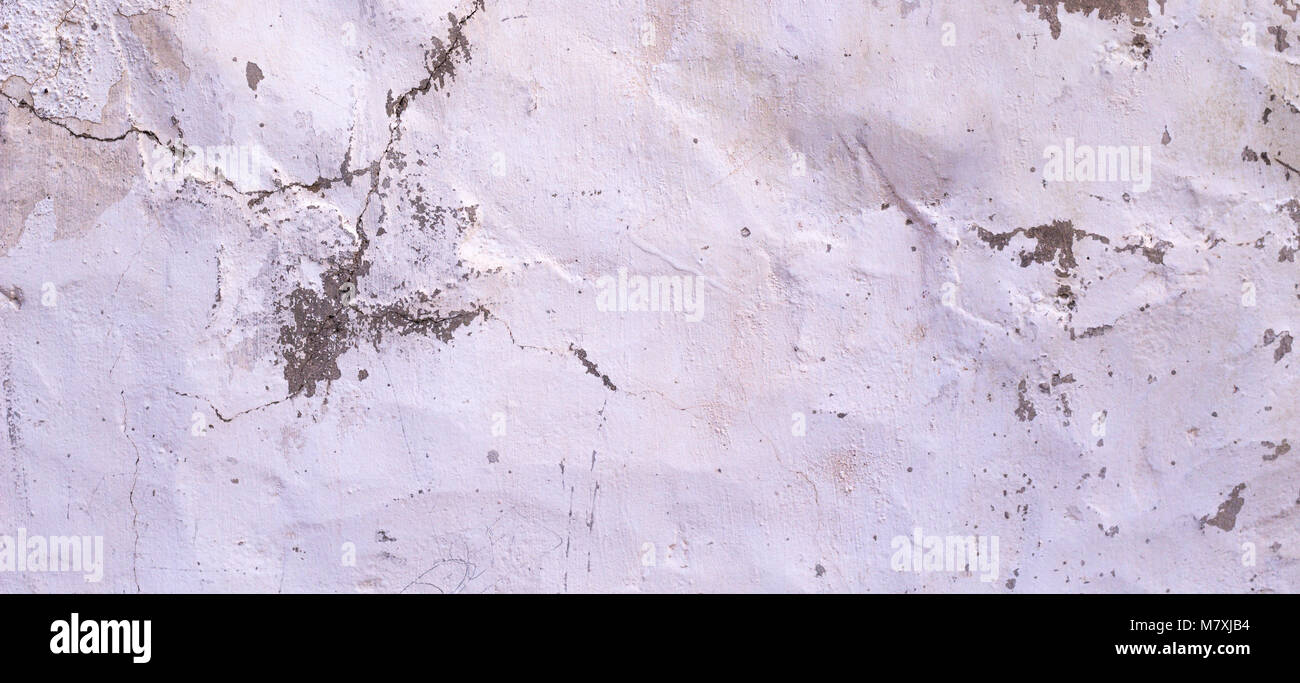 Vieux mur de plâtre blanc fissuré sécheresse bannière texture background Banque D'Images