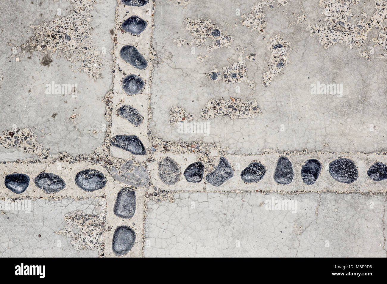 Le modèle abstrait de mur construit avec des cailloux Banque D'Images