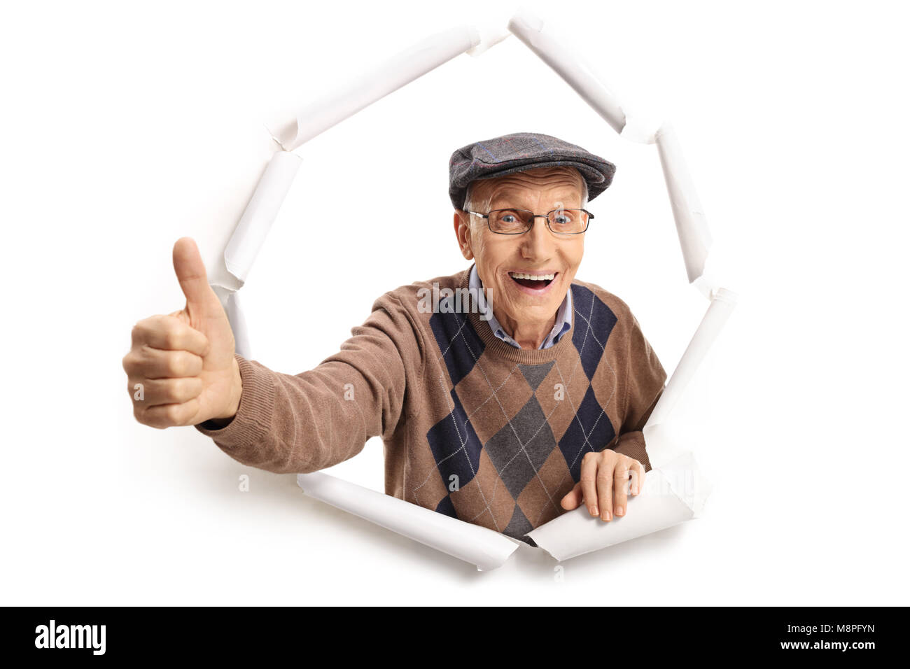 Cheerful senior briser de papier et en un thumb up sign Banque D'Images