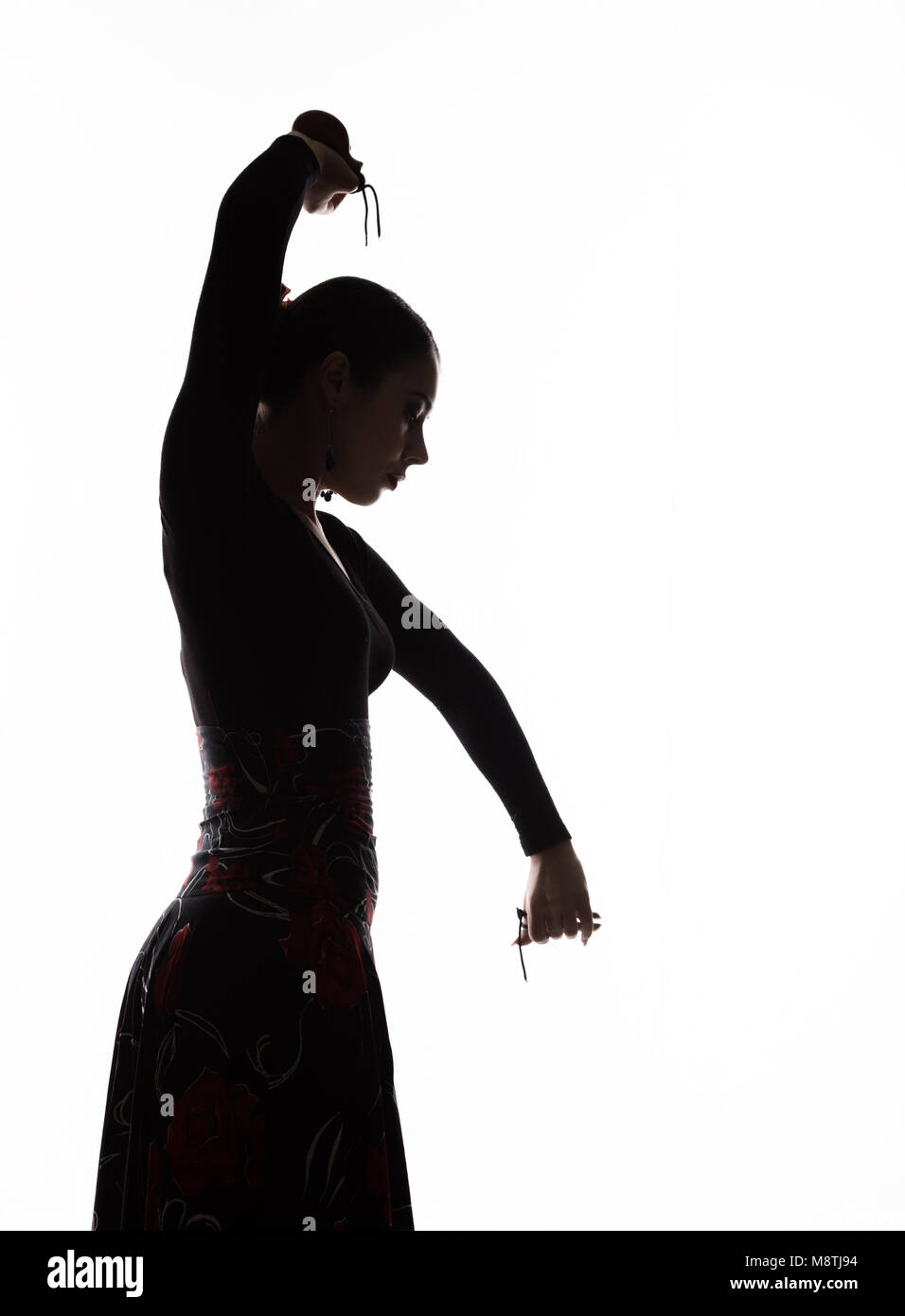 Silhouette de jeune fille espagnole danseuse flamenco sur un fond clair Banque D'Images