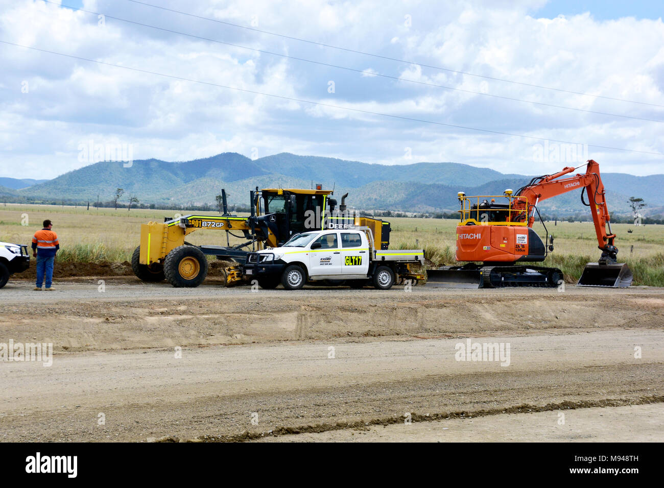 Travaux de voirie QUEENSLAND, HITACHI DIGGER, JOHN DEER GRADER Banque D'Images