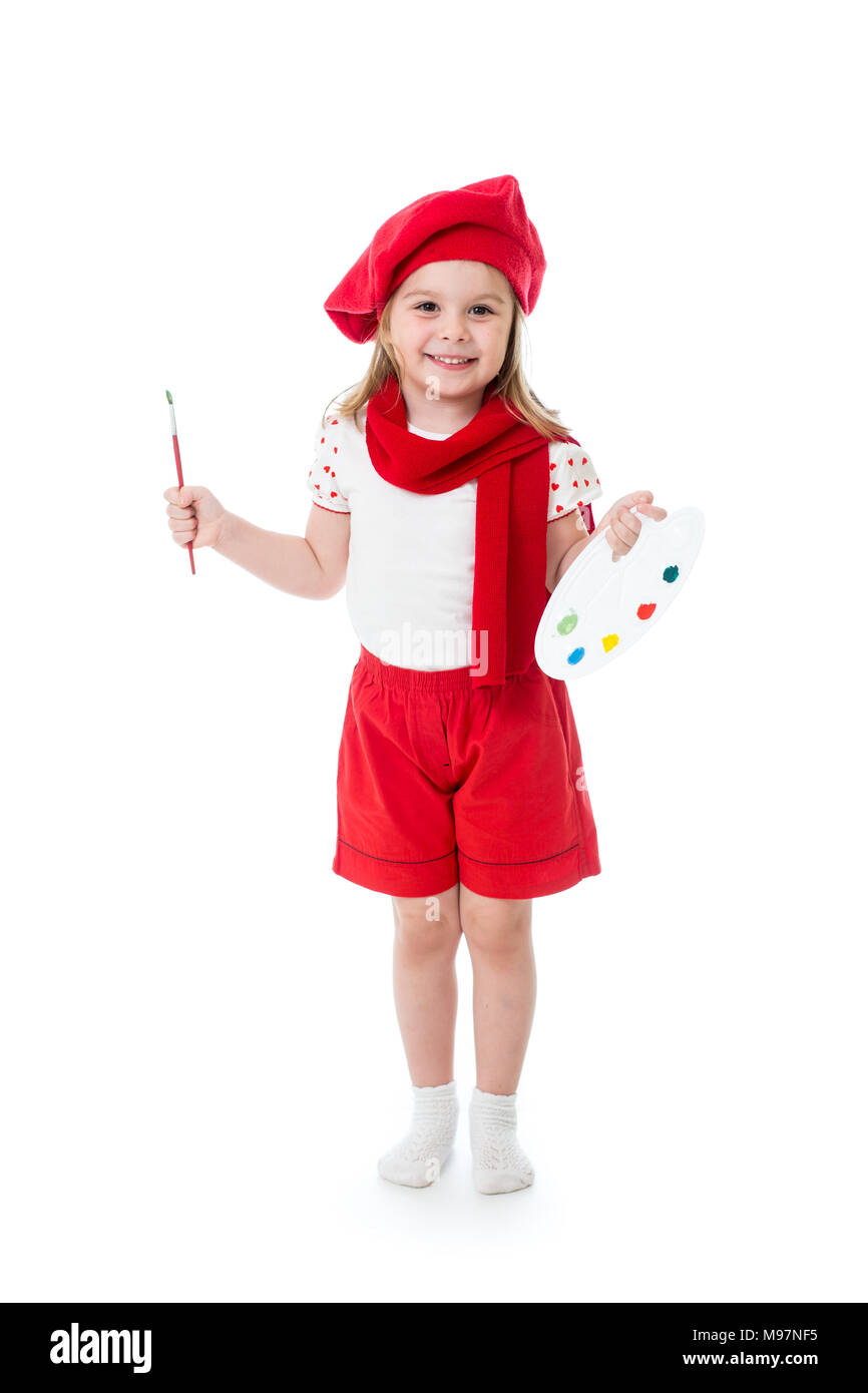 La petite fille en costume de l'artiste avec le pinceau et la palette Banque D'Images