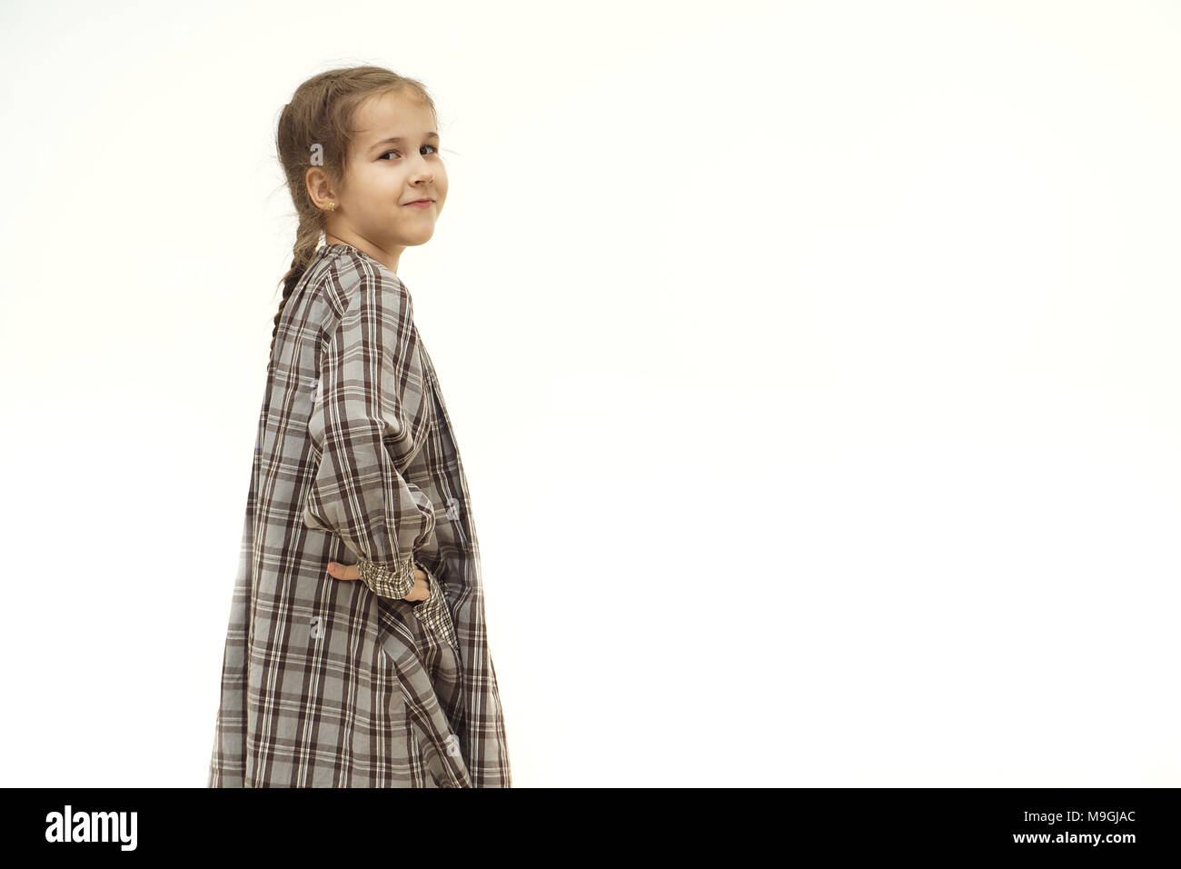 Full Length portrait of a happy little girl sur fond blanc Banque D'Images