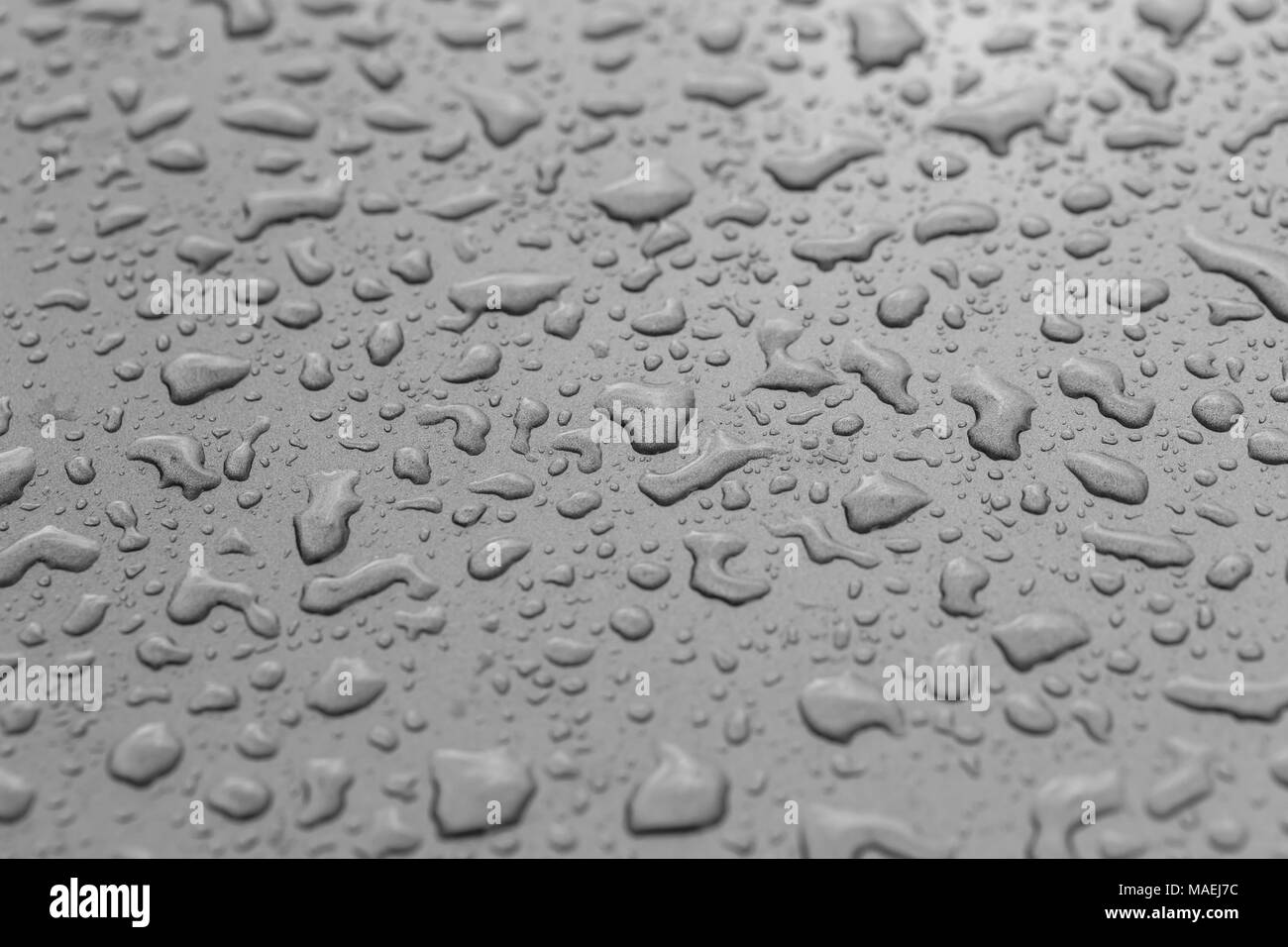 L'eau goutte de pluie sur la voiture en arrière-plan et les textures close up Banque D'Images