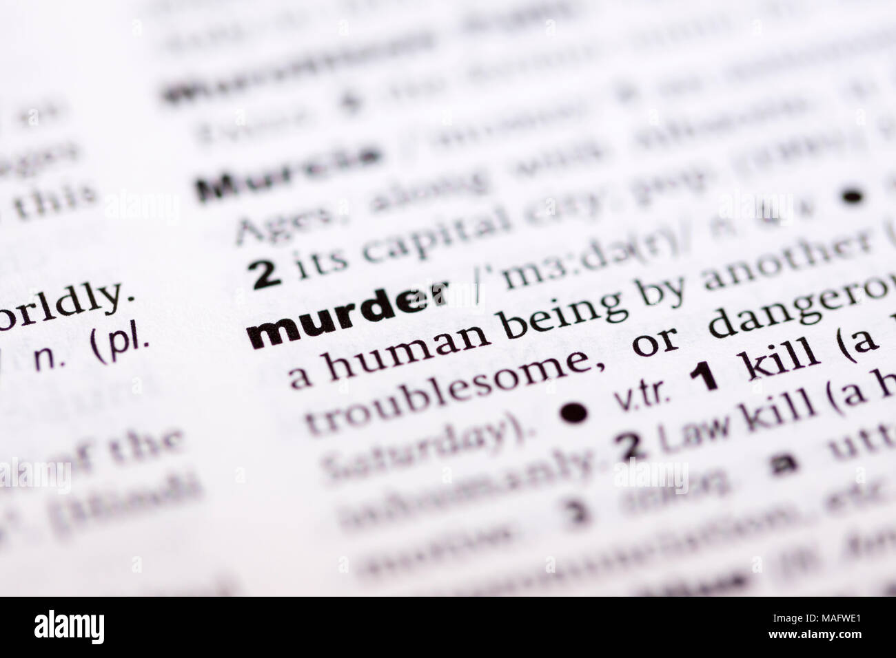 Une macro shot montrant la définition du mot meurtre dans un dictionnaire anglais Banque D'Images
