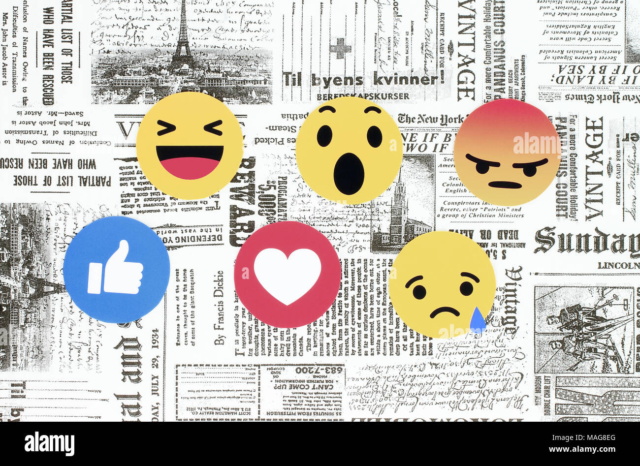 Kiev, Ukraine - 08 Février 2018 : Facebook like button 6 Réactions Emoji empathique imprimé sur du papier journal rétro et placé sur l'arrière-plan. Facebo Banque D'Images