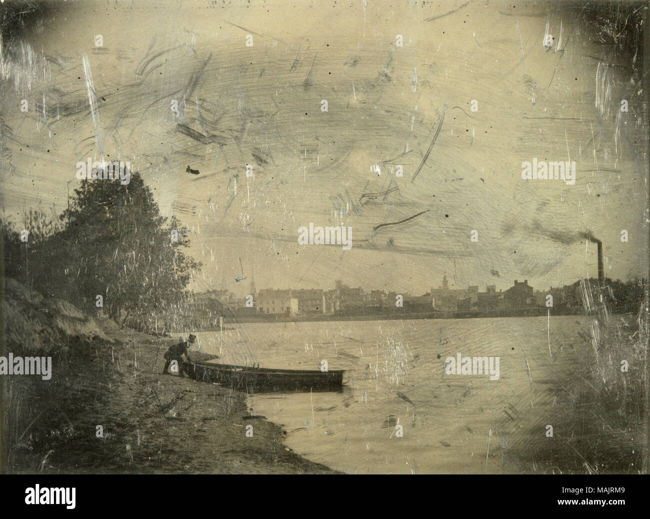 Homme avec top hat mettre voile dans l'eau de Chouteau's Pond. Divers bâtiments peut être vu à travers l'eau, y compris une cheminée. 'Chouteau's Pond' est inscrit sur le fond. Titre : Chouteau's Pond, Man putting voile dans l'eau. . 1852. Thomas M. Easterly Banque D'Images