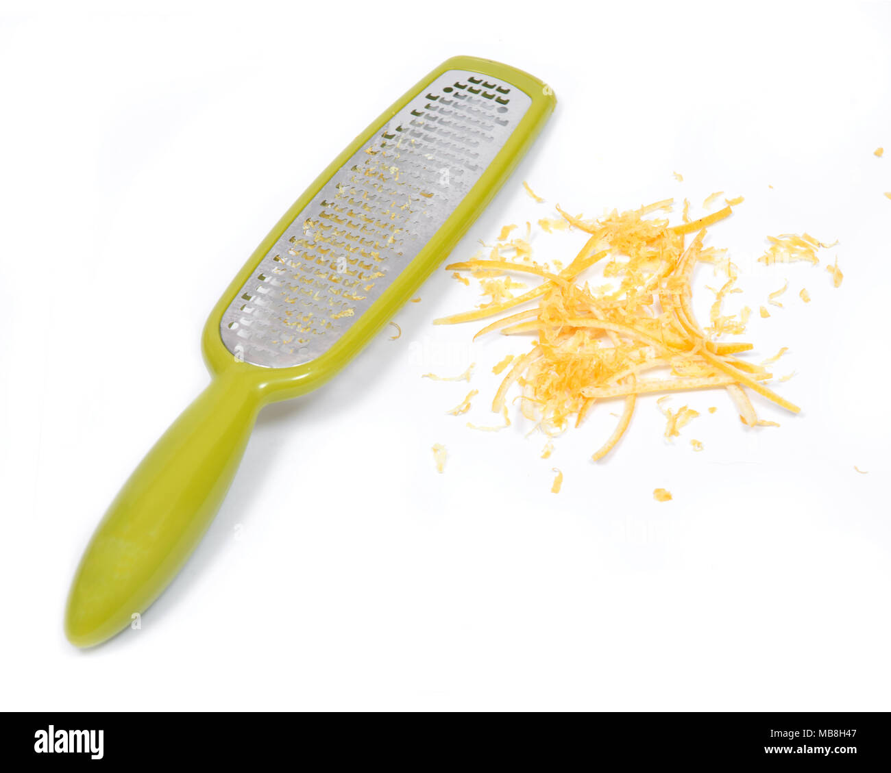 Grille en acier inoxydable zester et le zeste de citron, zeste isolé sur fond blanc Banque D'Images