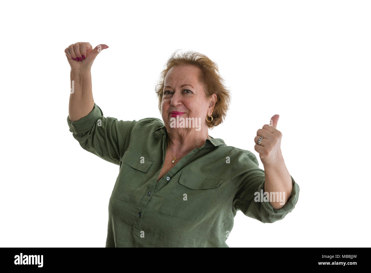 Portrait of happy senior lady giving Thumbs up against white background Banque D'Images