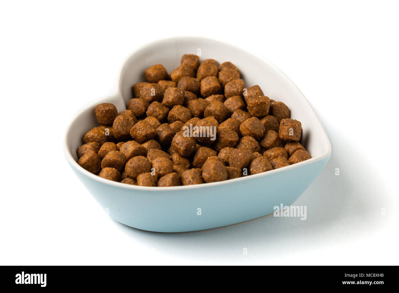 Les aliments pour animaux domestiques pile. vue en gros, isolated on white Banque D'Images