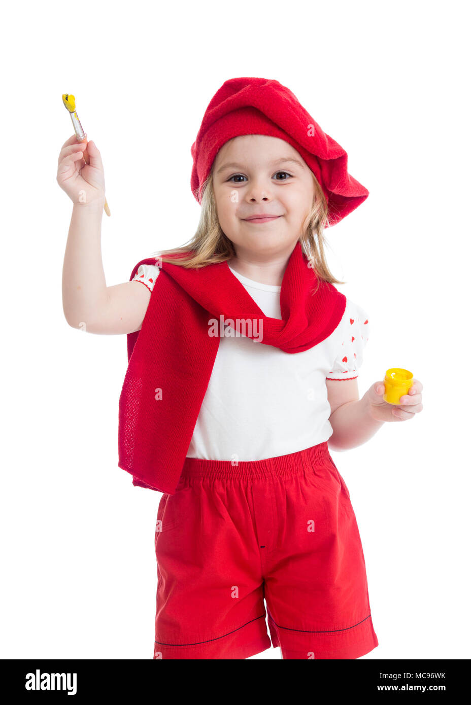 Petite fille avec le pinceau en costume de l'artiste Banque D'Images