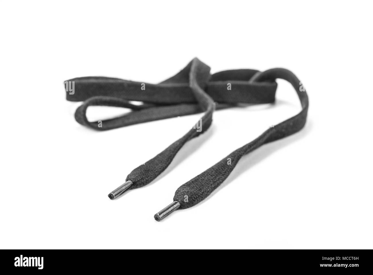 Lacet noir sur le fond blanc Banque D'Images