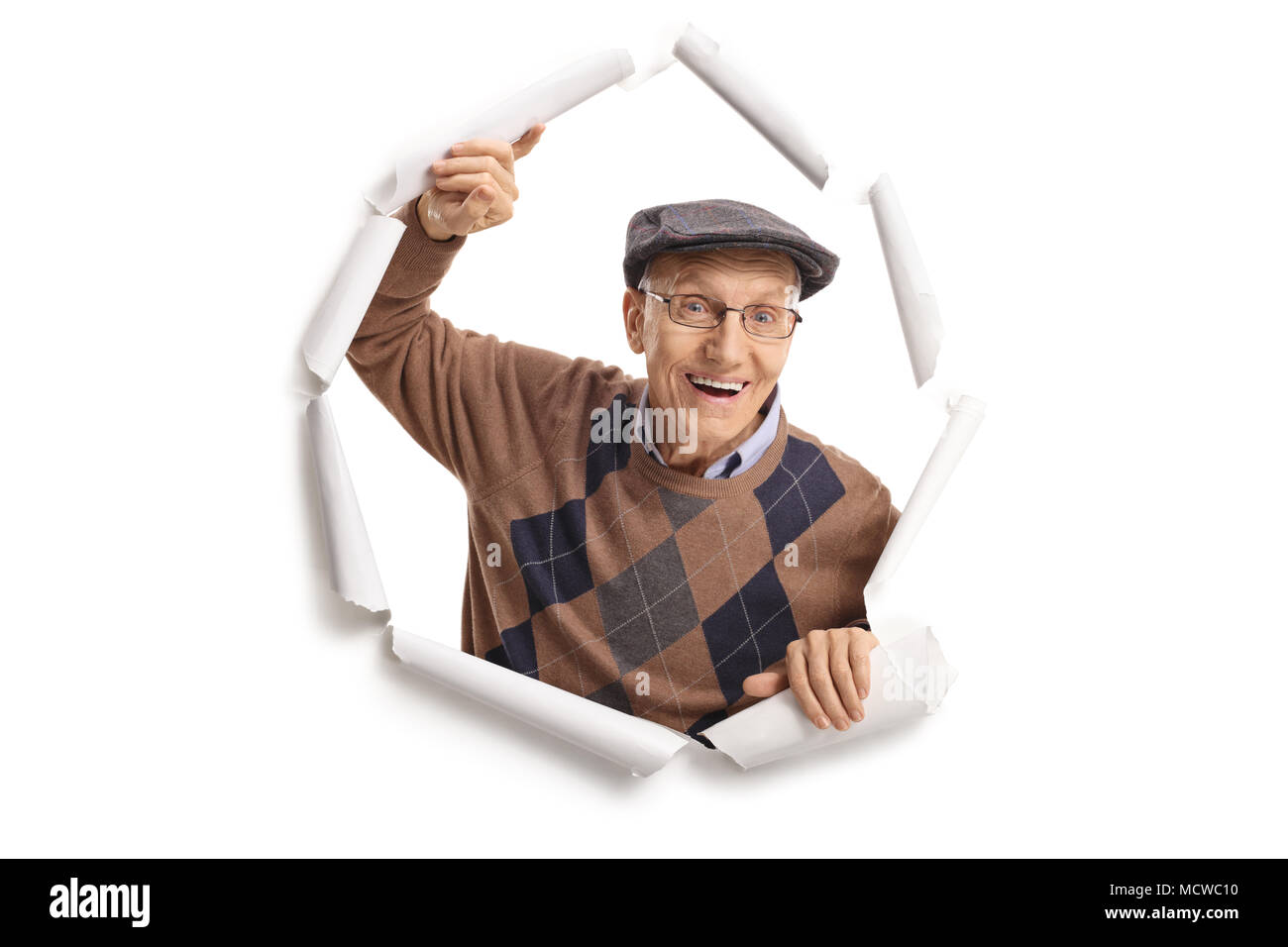 Cheerful man Breaking through paper Banque D'Images