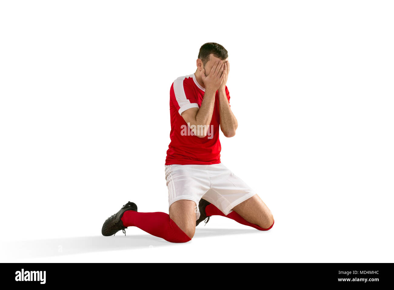 Joueur de football ou soccer malheureux avec palm sur son visage Banque D'Images