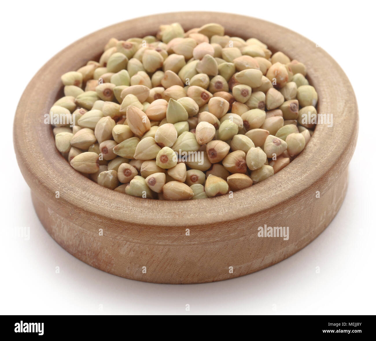 Le sarrasin dans un bol sur fond blanc Banque D'Images