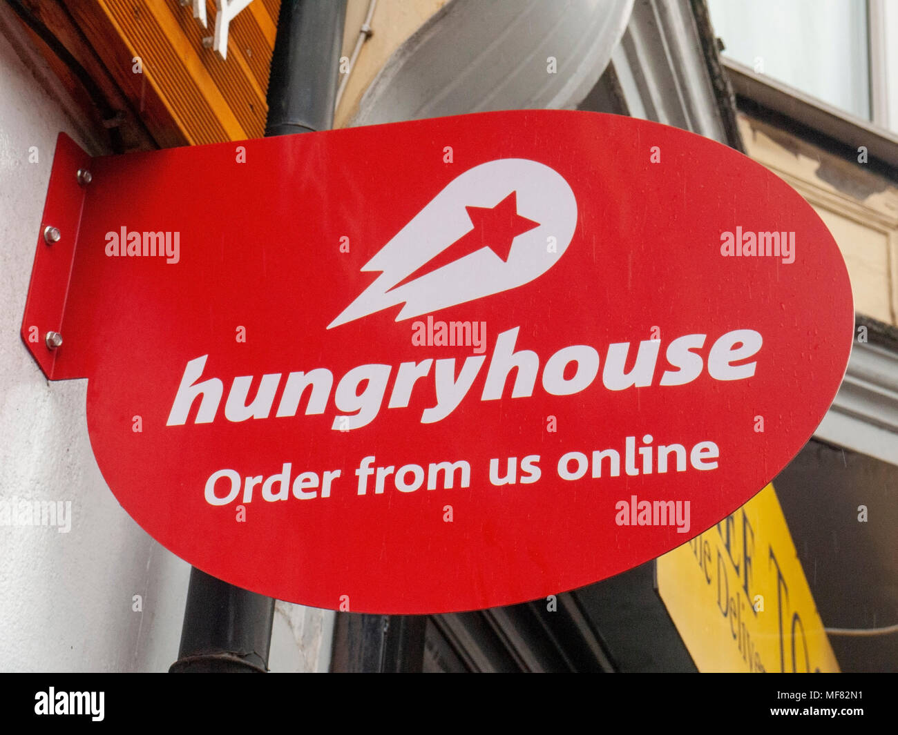 Hungryhouse signe sur mur extérieur UK Banque D'Images