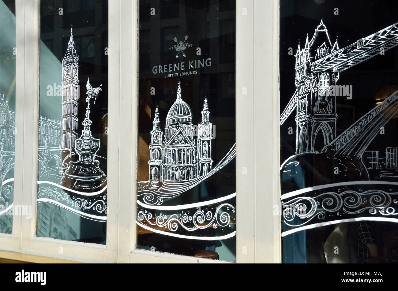 Une fenêtre London pub montrant des endroits touristiques. Banque D'Images