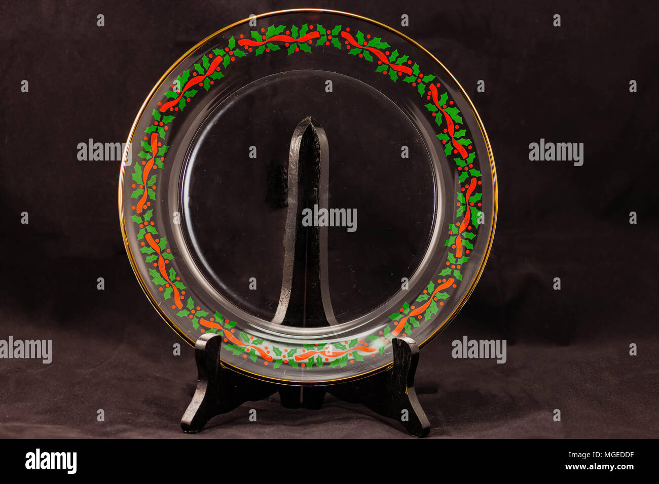 Une plaque de verre clair pour maison de coin bordé de Holly Banque D'Images