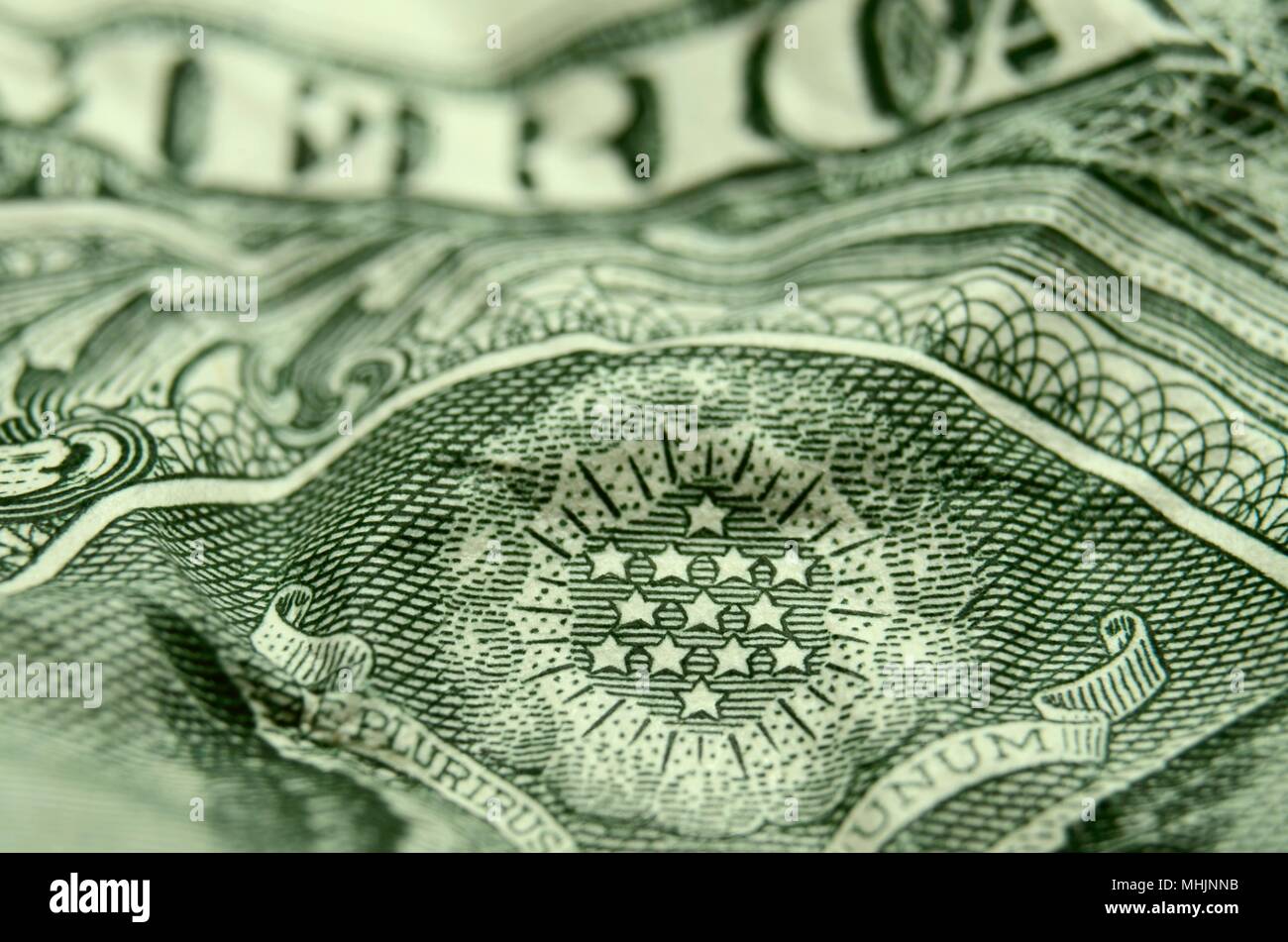 L'accent peu profondes de l'étoile du grand sceau sur sur un papier froissé American dollar bill. Banque D'Images