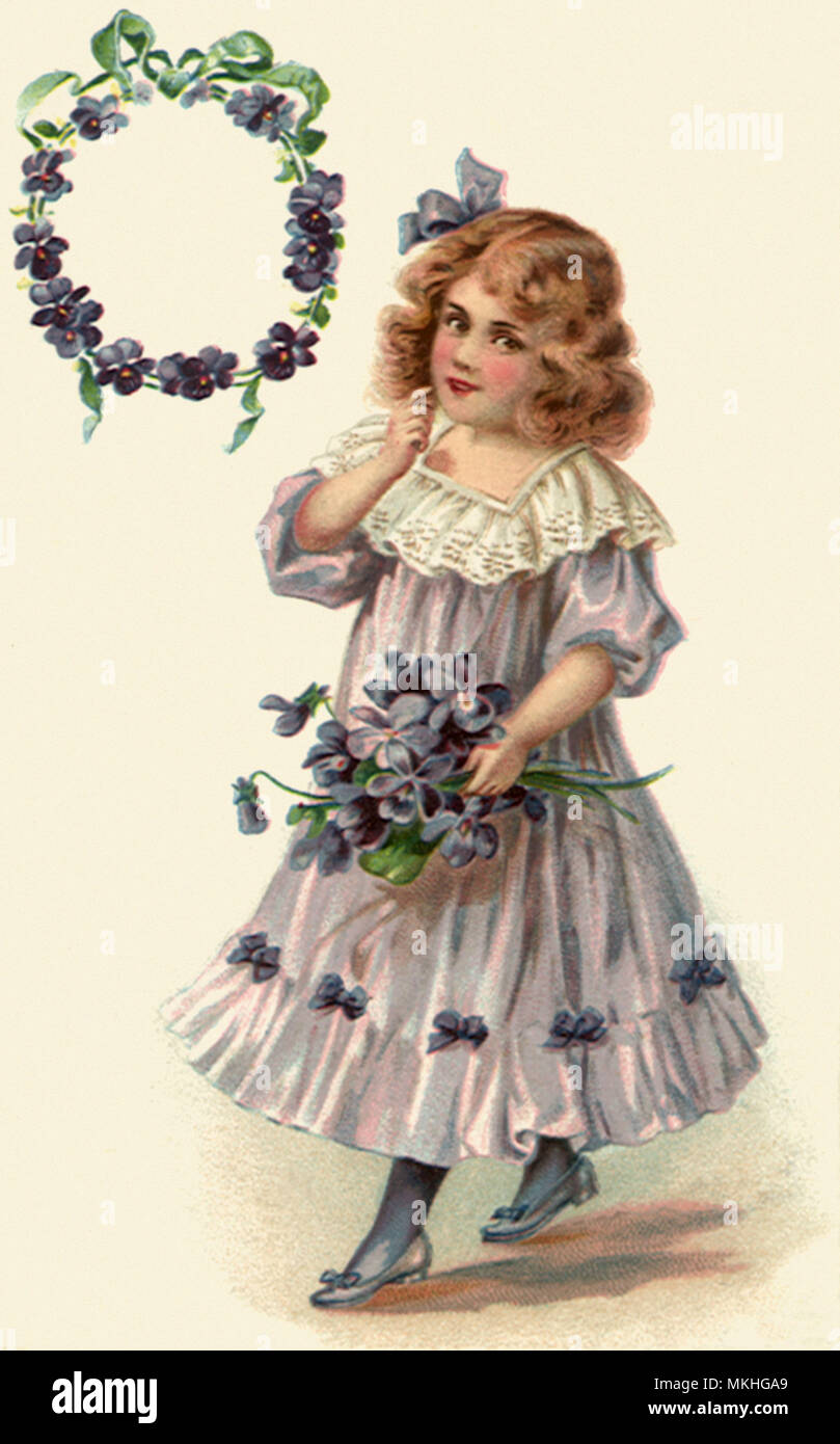 Girl Holding Fleurs d'anniversaire Banque D'Images
