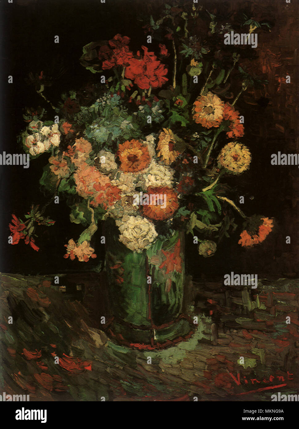 Vase avec Zinnias et géraniums Banque D'Images