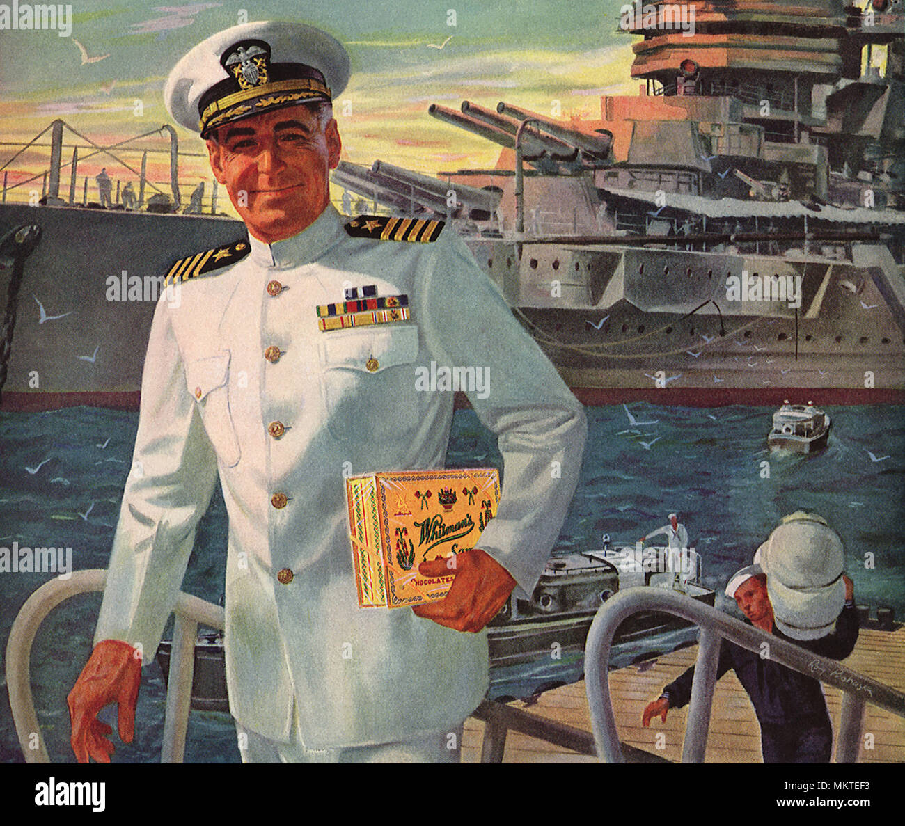 Officier de marine avec une boîte de chocolats Banque D'Images