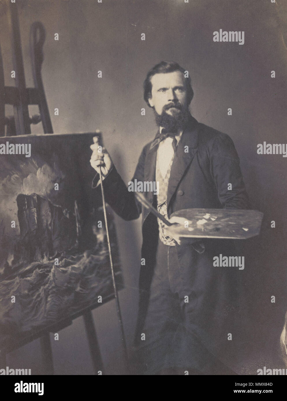 . Portrait de l'artiste américain Edward Moran (1829-1901), tenant une palette et pinceaux, debout à côté d'un chevalet avec une peinture gothique d'un navire en mer au cours d'une tempête. Le portrait a été réalisé par son frère, l'artiste John Moran. Portrait provenant des collections de la société de la bibliothèque de Philadelphie. LCP-MoranEdward-photoportrait-P-8449 . 1860. John Moran Edward Moran debout, tenant une palette et pinceaux Banque D'Images