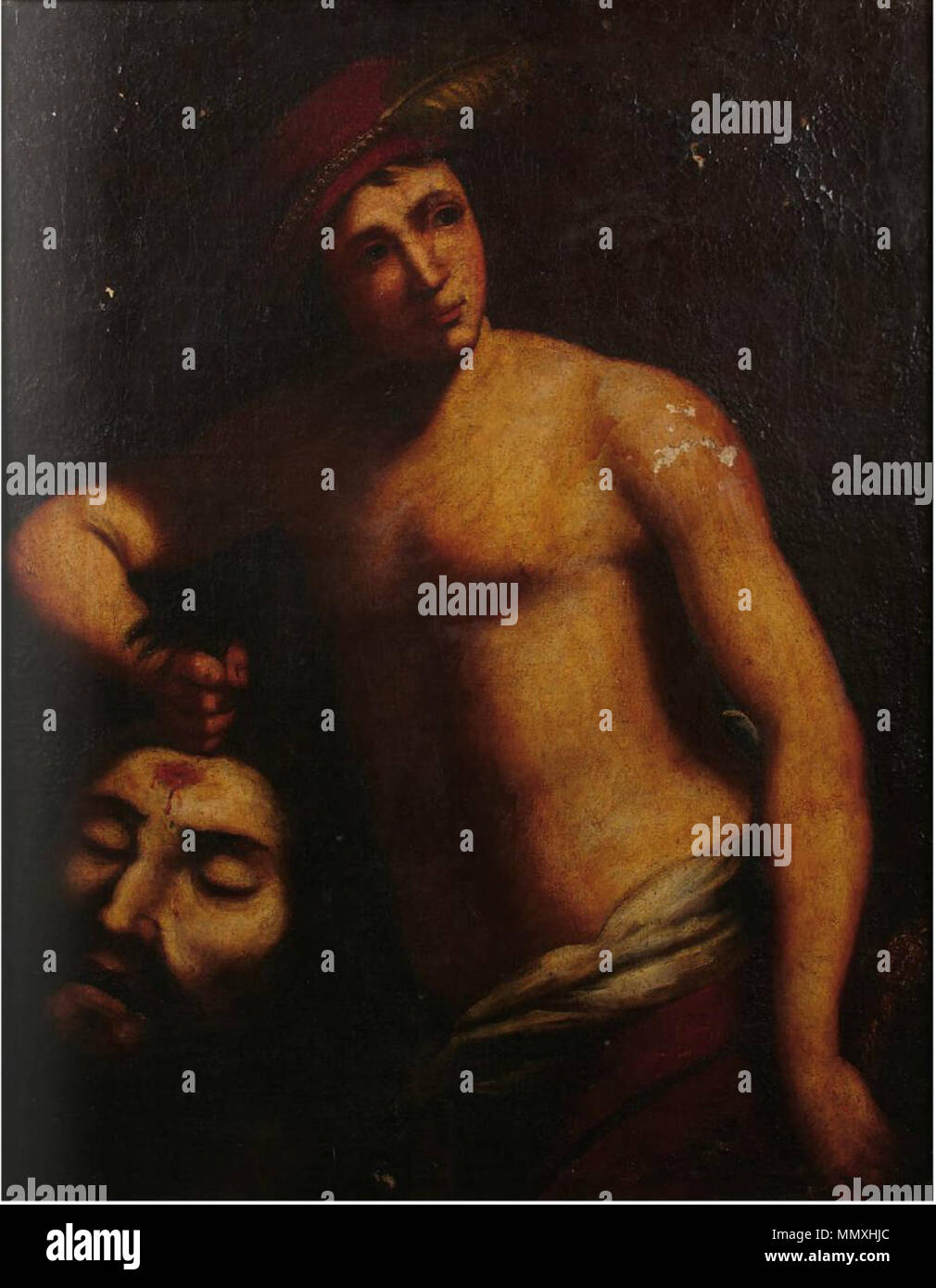 . David et Goliath . Entre 1600 et 1650. Annibale Caracci adepte d'Annibale Caracci - disciple de David avec la tête de Goliath Banque D'Images