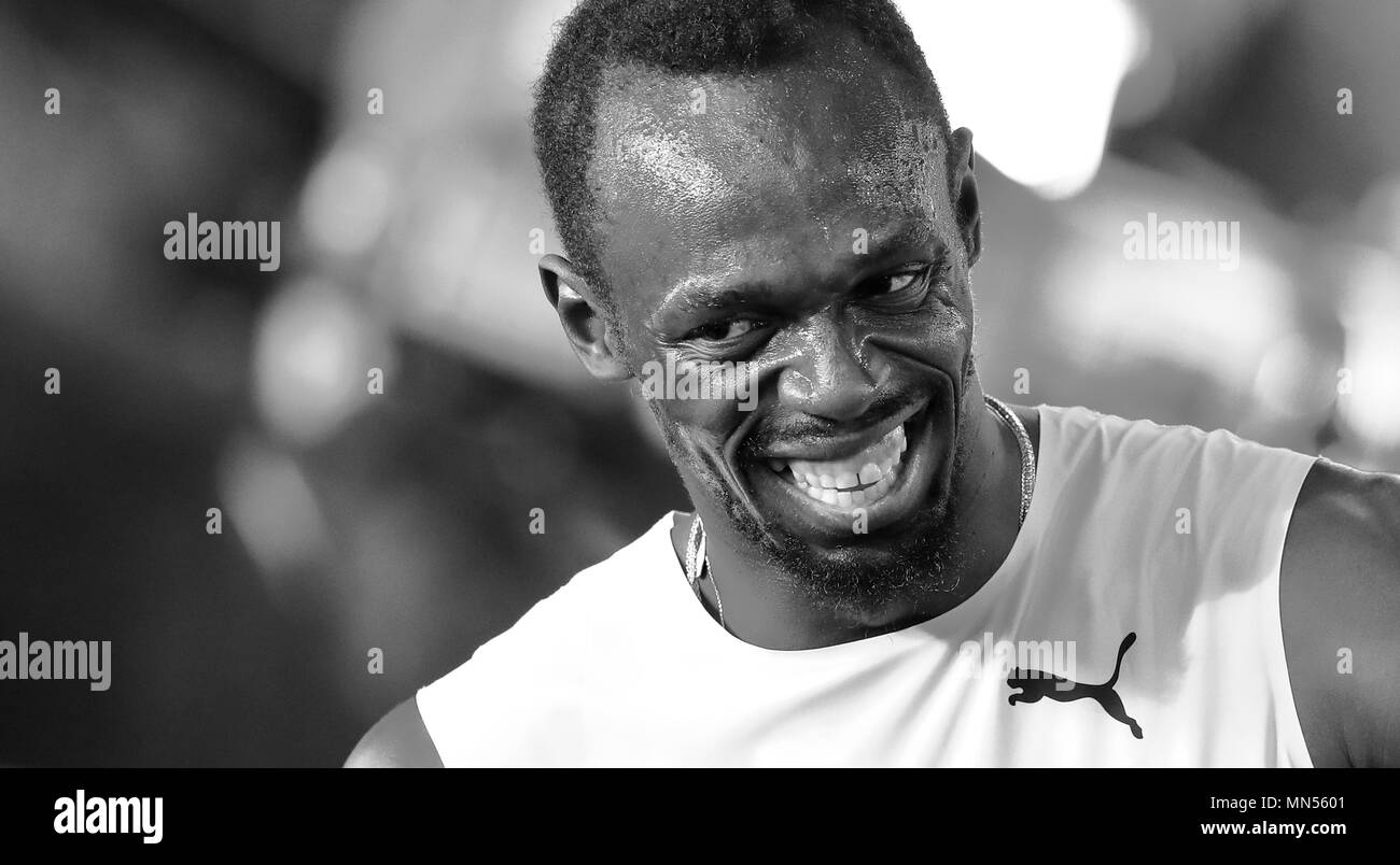 Londres, ANGLETERRE - 04 août : (Note de la rédaction : l'image convertie en noir et blanc) de la Jamaïque, Usain Bolt réagit avec un grand sourire au cours de la chaleur 6 de la 1re Ronde d'Hommes 100 mètres au cours de la première journée de la 17e Championnats du monde d'athlétisme IAAF Londres 2017 au stade de Londres le 4 août 2017 à Londres, Royaume-Uni. Photo par Paul Cunningham Banque D'Images